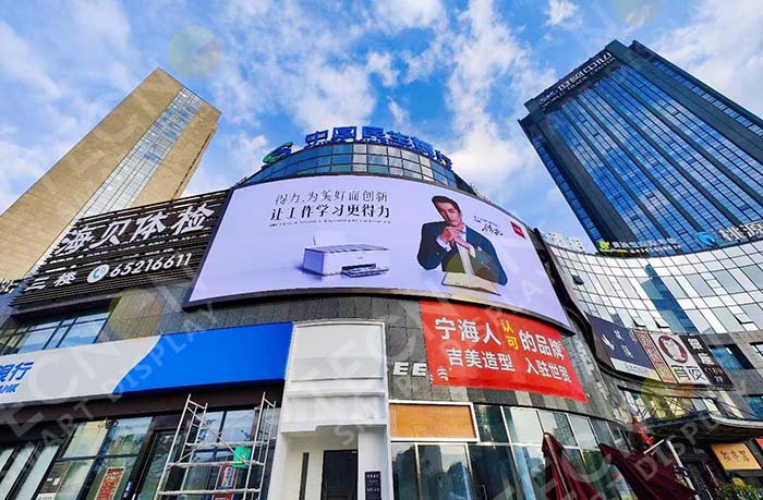 Outdoor LED display functioning normally after heavy rainfall, showcasing reliable waterproof design and sealed cabinet structure.