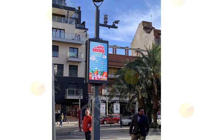 pole LED banners installed back-to-back on street light poles for synchronized outdoor display.