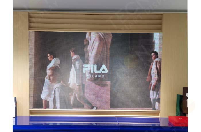 LED advertising display showing brand content in FILA store